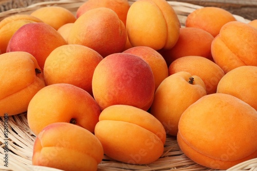 Delicious fresh apricots on the table macro