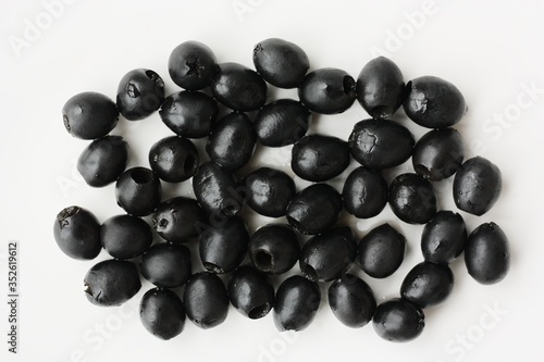 Delicious black olives on a white plate © Angelic