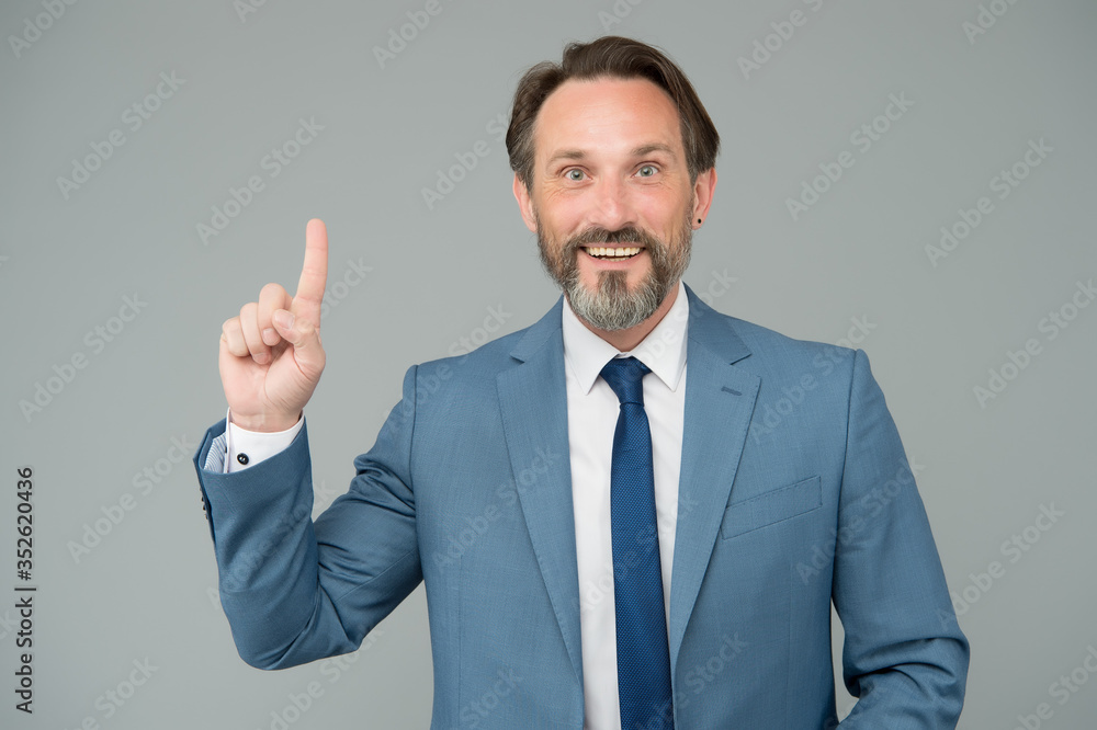 Business idea inspiration. Businessman point finger up grey background. Bearded man got idea. Marketing idea and strategy. Entrepreneurship activities. From idea to startup Business idea inspiration. Businessman point finger up grey background. Bearded man got idea. Marketing idea and strategy. Entrepreneurship activities. From idea to startup