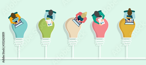 Top view of office employees working at tables shaped as light bulbs, vector illustration in flat style