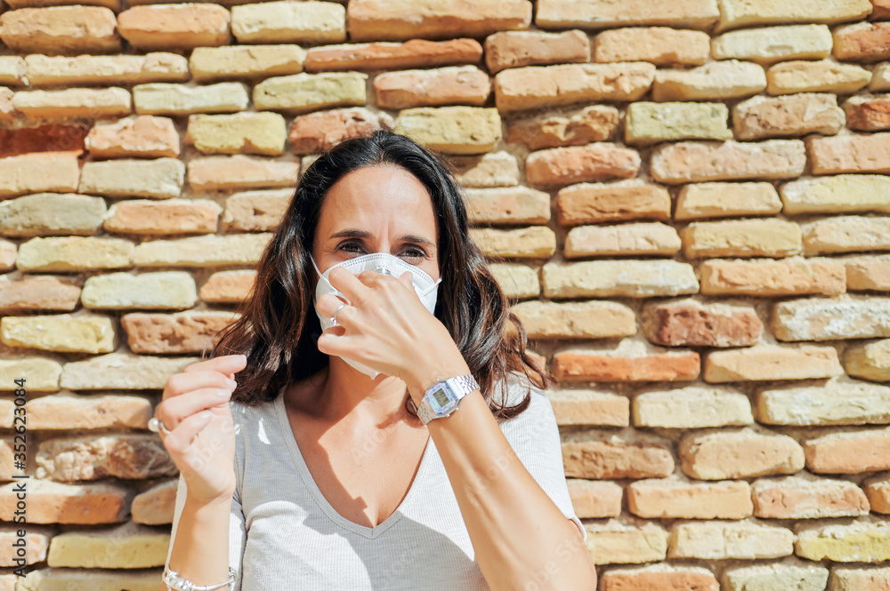 Woman with antiviral mask outdoors Woman with antiviral mask outdoors