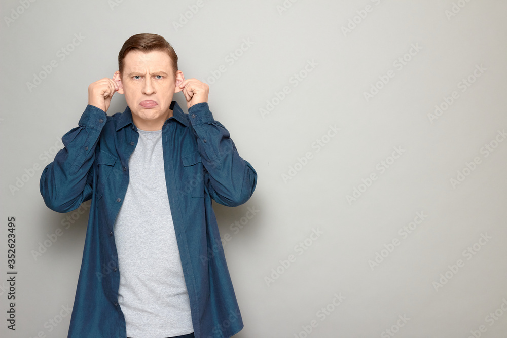 Portrait of funny mature man fooling around and making goofy face Portrait of funny mature man fooling around and making goofy face