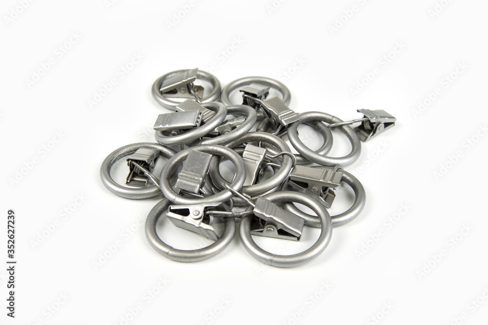 Metal curtain ring with clipper in a white background Metal curtain ring with clipper in a white background