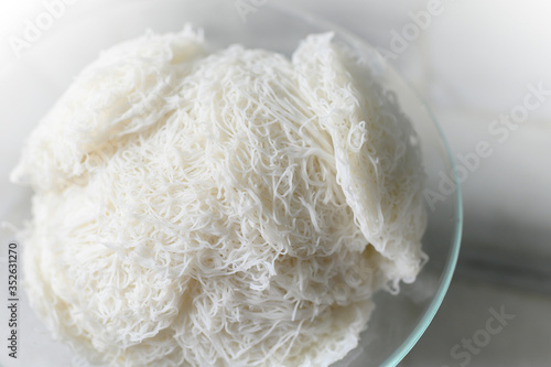 Idiyappam or string hoppers is a popular traditional breakfast cuisine of Kerala, South India. Rice flour pressed into white noodle form and then steamed.