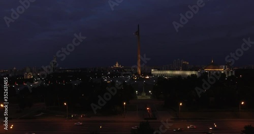 4K night aerial video of Kutuzovskiy Avenue highway at Victory Park and memorial complex in Poklonnaya Hill, near Moscow River in Moscow, Russia