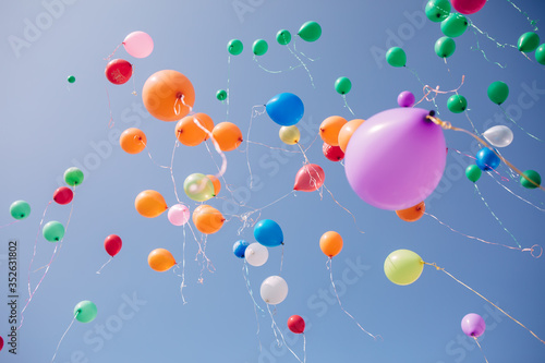 multi-colored balloons in the sky, back to school concept, the concept of starting school