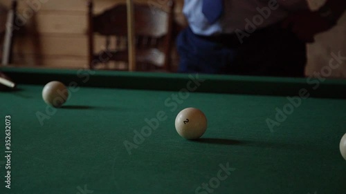 Wallpaper Mural The player hits the cue ball billiards, a man in a shirt approaches the pool table in a dark room Torontodigital.ca