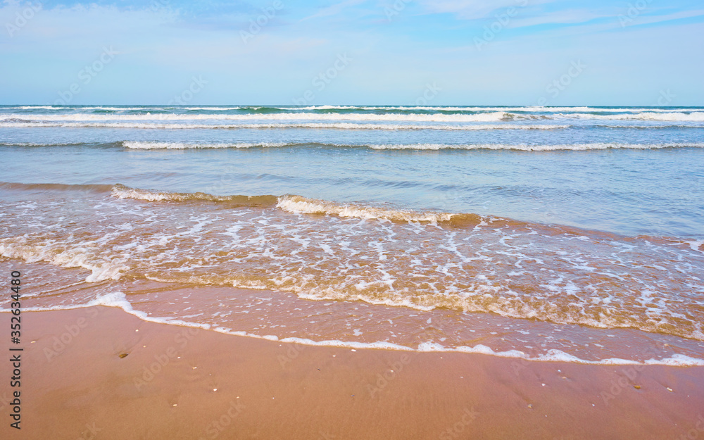 Seashore at sunset in the Mediterranean Sea. Waves beating on the beach Seashore at sunset in the Mediterranean Sea. Waves beating on the beach
