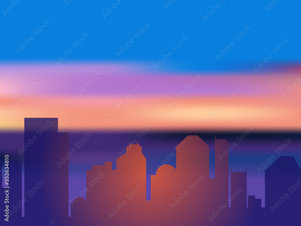 Silhouettes of city buildings against the background of the sea dawn or sunset