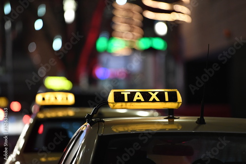 German taxi line up at station at night