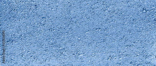 Navy Blue Textured cement or concrete wall background.