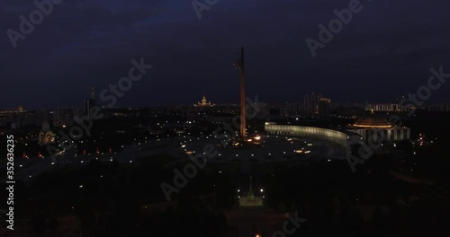 Victory Park 4K night aerial video with background view of Moscow City Business Center, Kutuzovskiy Avenue busy road traffic, memorial complex in Poklonnaya Hill, near Moscow River in Moscow, Russia