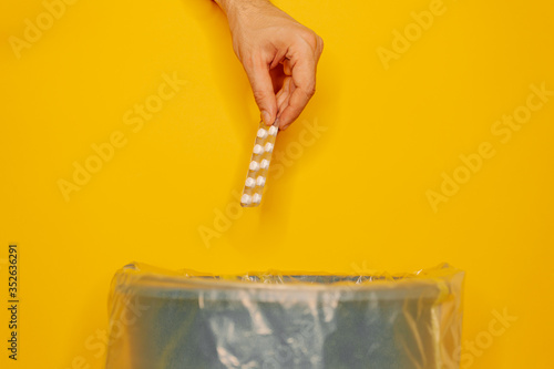 Canvastavla hand throwing pills away. Health concept