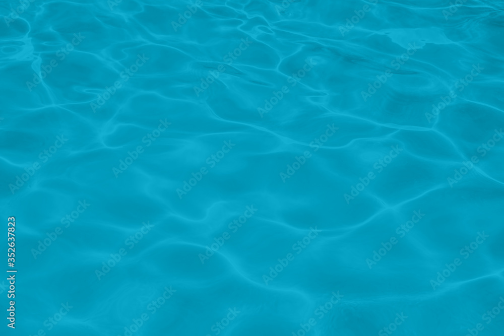 Closeup of rough water surface texture with splashes and bubbles in mint blue color. Trendy fresh abstract nature background. 2021 color trend Closeup of rough water surface texture with splashes and bubbles in mint blue color. Trendy fresh abstract nature background. 2021 color trend
