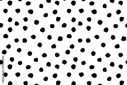 Vector abstract background with polka dots pattern in a chaotic manner. Hand drawn, doodle style.