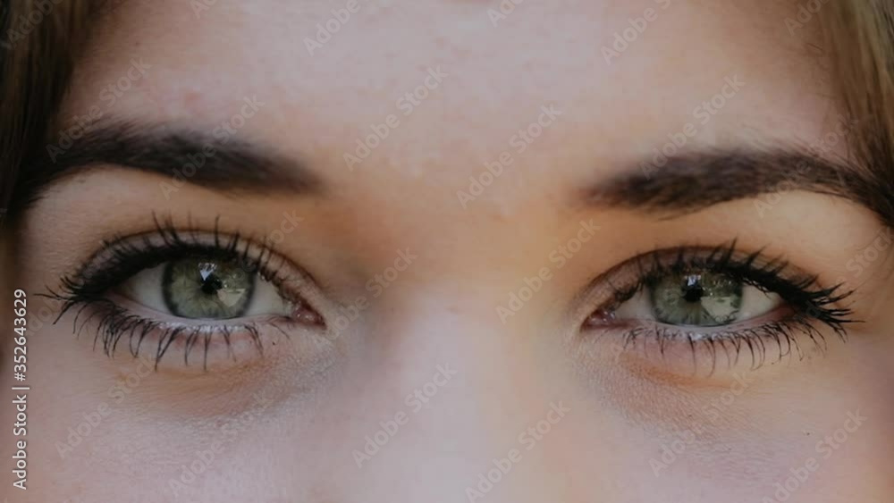 Close-Up of Young Woman’s Blinking Eyes, Slow Motion Macro Shot of Female Eyes Opening and Closing with Natural Long Eyelashes. Close-Up of Young Woman’s Blinking Eyes, Slow Motion Macro Shot of Female Eyes Opening and Closing with Natural Long Eyelashes.