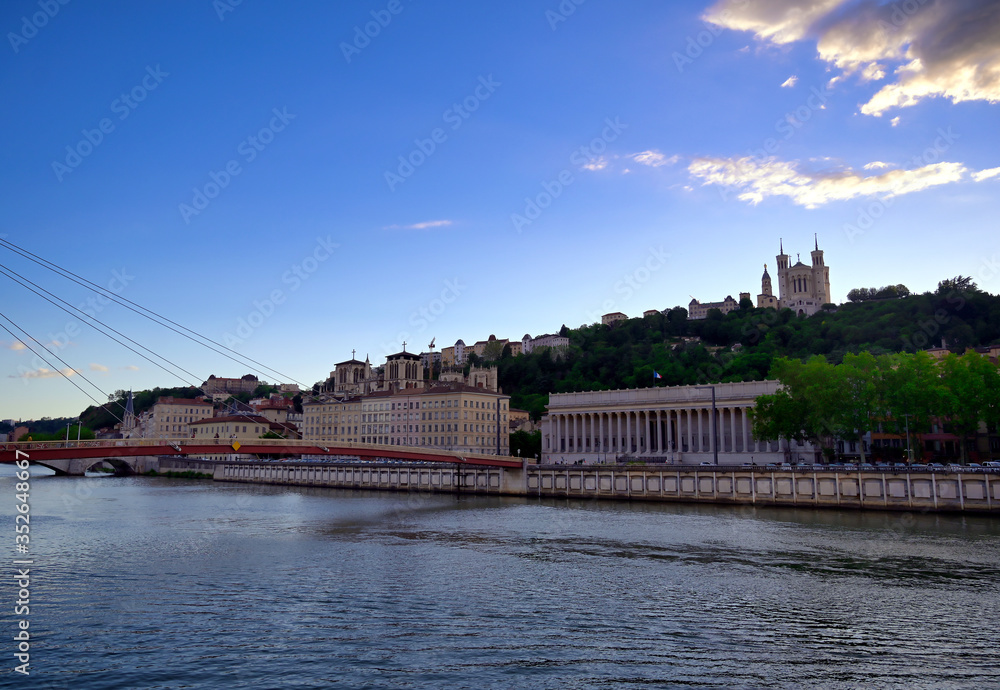 Obraz premium The Basilica of Notre Dame de Fourviere overlooking Lyon, France and the Saone River.