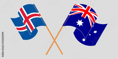 Crossed and waving flags of Iceland and Australia