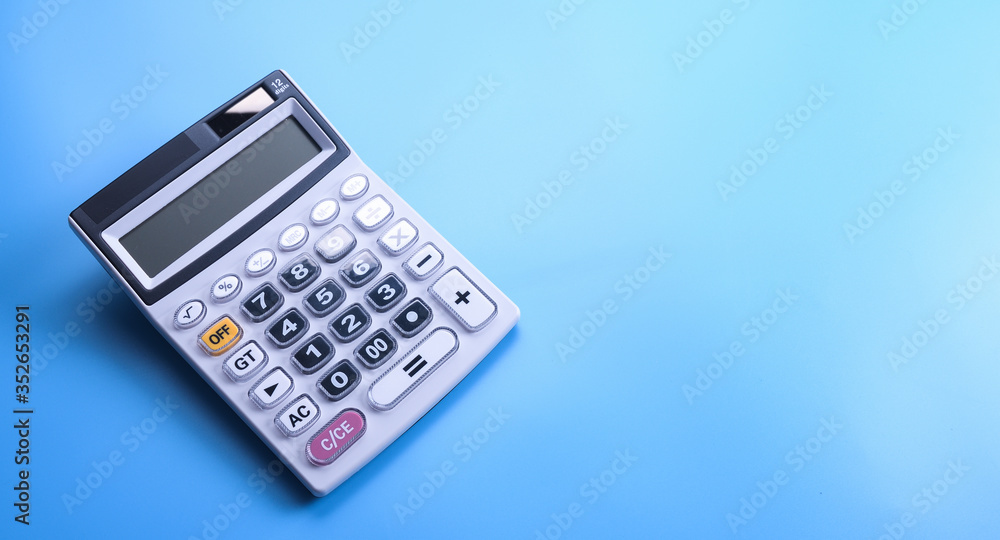 Calculator keypad on a blue background. Top view. Copy space Calculator keypad on a blue background. Top view. Copy space