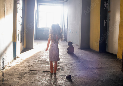 Doll-toy and toy bear in the corridor.