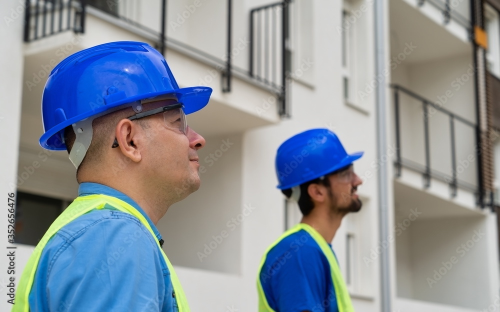 The site manager and foreman oversee the works.The construction site theme. The site manager and foreman oversee the works.The construction site theme.