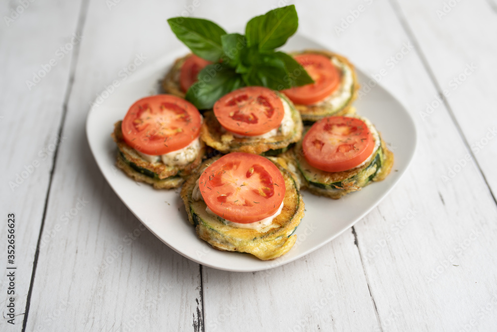 Fried zucchini with tomato dill mayonnaise and garlic sauce. Russian, European appetizer Fried zucchini with tomato dill mayonnaise and garlic sauce. Russian, European appetizer
