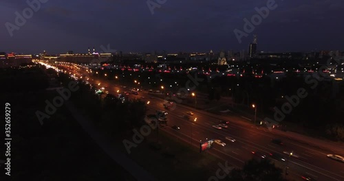 4K night aerial video of Kutuzovskiy Avenue highway at Victory Park and memorial complex in Poklonnaya Hill, near Moscow River in Moscow, Russia