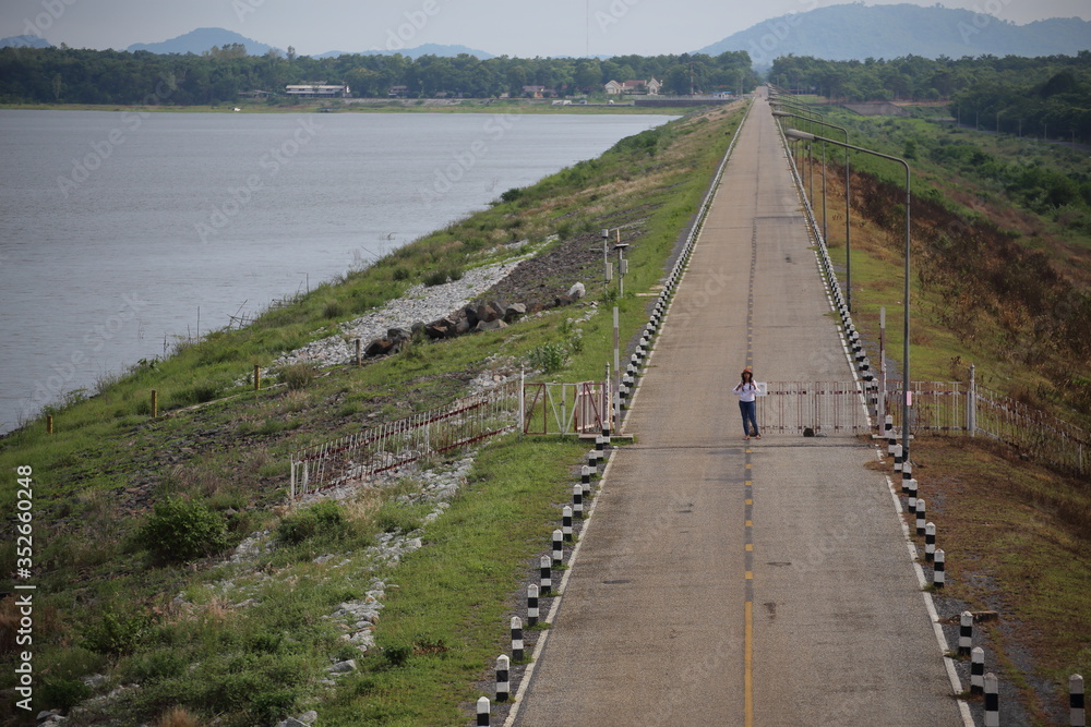 Women standing on the reservoir road Women standing on the reservoir road