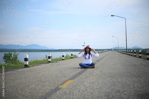 Woman sitting on the streets of the reservoir