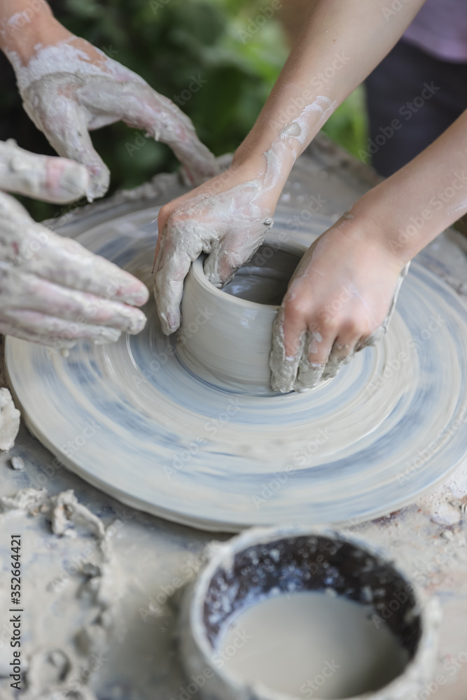 Hands on a potter's wheel - master class for children and adults