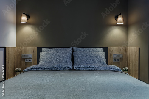 Double bed lamp and modern pillows in interior
