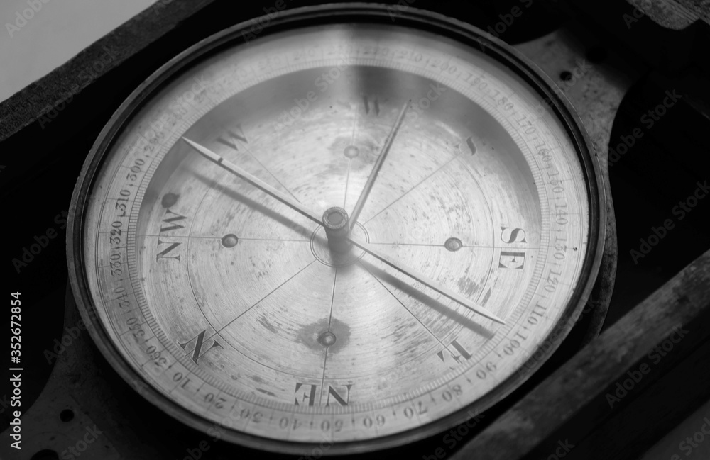 old compass on a wooden background