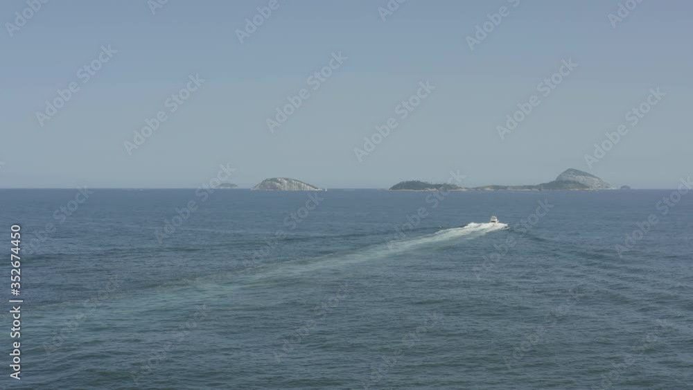 Aerial shot of a motorboat in the ocean near Rio de Janeiro coast in Brazil Aerial shot of a motorboat in the ocean near Rio de Janeiro coast in Brazil