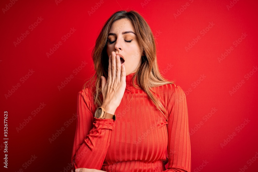 Young beautiful brunette woman wearing casual turtleneck sweater over red background bored yawning tired covering mouth with hand. Restless and sleepiness. Young beautiful brunette woman wearing casual turtleneck sweater over red background bored yawning tired covering mouth with hand. Restless and sleepiness.