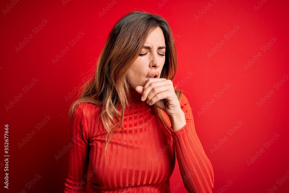 Young beautiful brunette woman wearing casual turtleneck sweater over red background feeling unwell and coughing as symptom for cold or bronchitis. Health care concept. Young beautiful brunette woman wearing casual turtleneck sweater over red background feeling unwell and coughing as symptom for cold or bronchitis. Health care concept.
