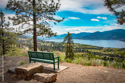 A bench on the kvr trail overlooks the Okanagan Lake in Penticton Bc