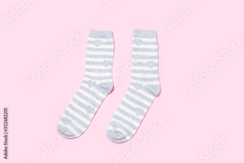 One pair of Women's socks on a colored background