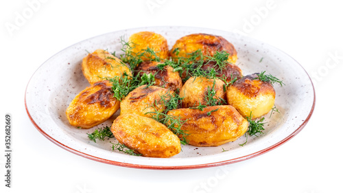 Fried fresh potatos and dill on a plate isolated on a white background
