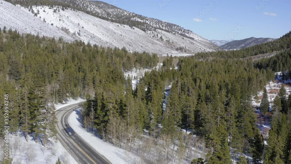 Buena Vista country road in winter season, Colorado, USA. Aerial forward Buena Vista country road in winter season, Colorado, USA. Aerial forward