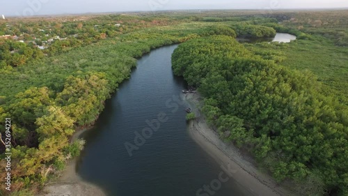 Aerial reverse of Dajabón or Massacre river close to Haiti photo