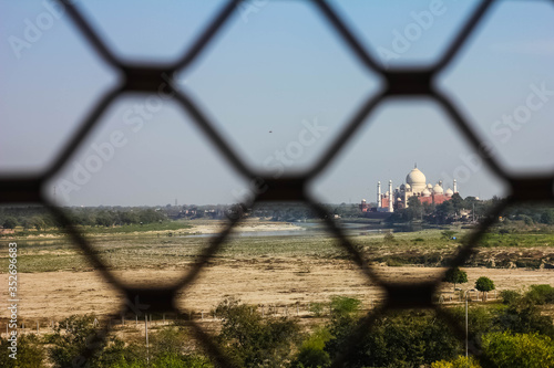 view of Taj Mahal through jali from red fort in agra, uttar pradesh