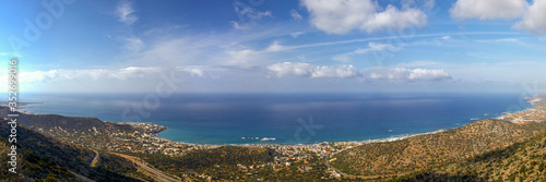 View on the wonderful resort town in vally on se coast. Delightful bay in the rays of sunlight. Mediterranean resort in a wonderful bay on a sunny day.