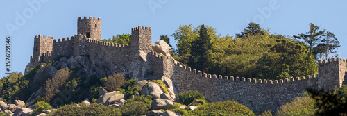 Medieval old european castle on top of a mountain photo