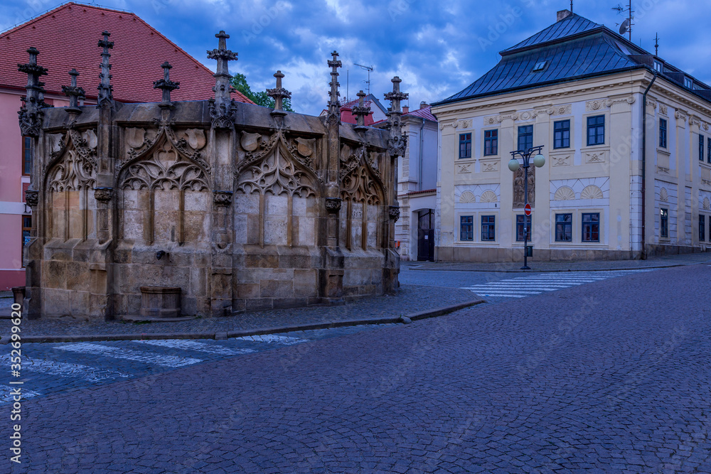 Picturesque historic city. Gothic stone fountain located on square in historic city. World Heritage Site by UNESCO. Kutna Hora, Czech Republic