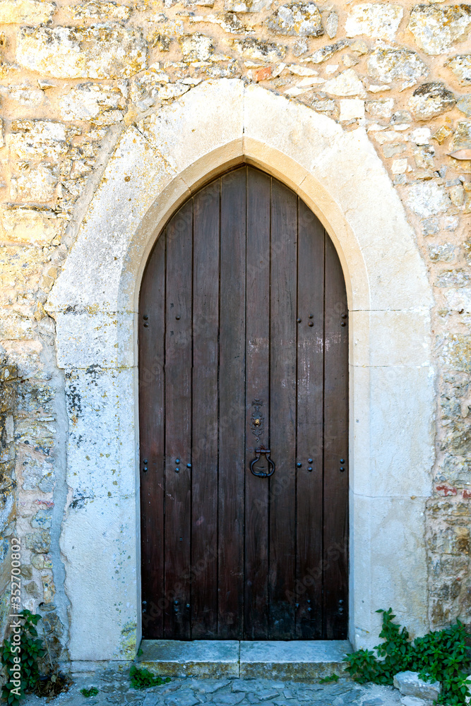 Closed wooden door of medieval fortress in Europe