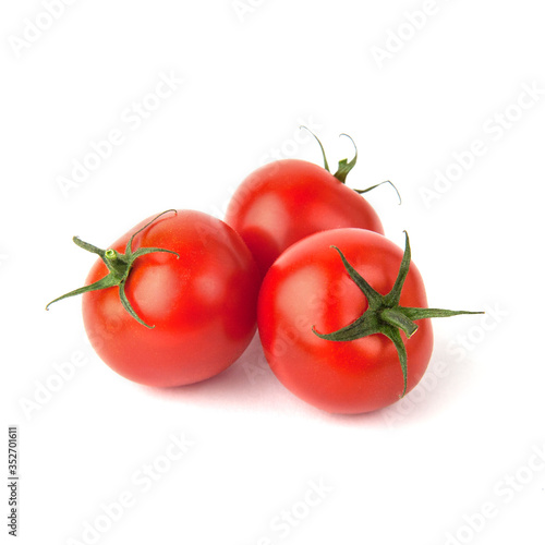 Ripe cherry tomatoes isolated on white background