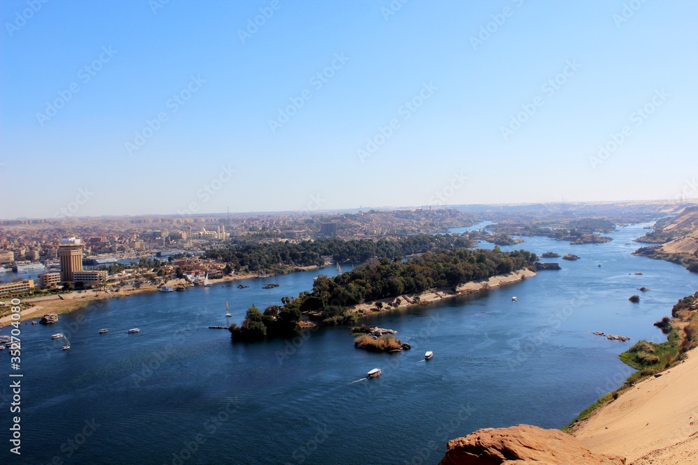 Aswan City skyline showing the Nile and boats