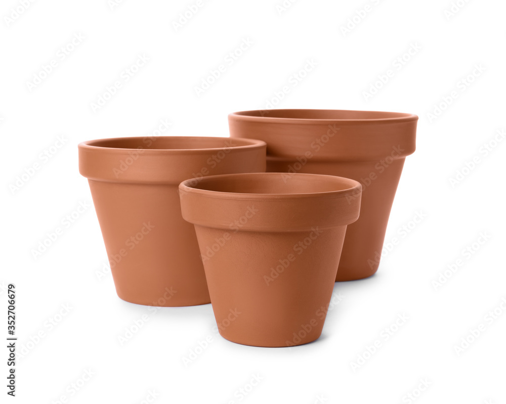 Stylish terracotta flower pots isolated on white Stylish terracotta flower pots isolated on white