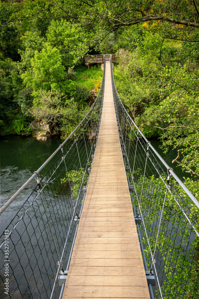 Suspension bridge over the Paiva river, on the Paiva Walkways, near Arouca in Portugal.