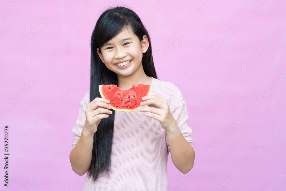 Portrait of a little girl with watermelon, summer isolated on pink background. Portrait of a little girl with watermelon, summer isolated on pink background.